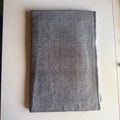 Grey textured fabric with a subtle speckled pattern