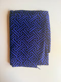 Black and blue geometric intricate maze-like motif