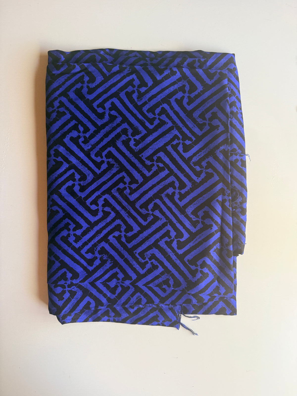 Black and blue geometric intricate maze-like motif