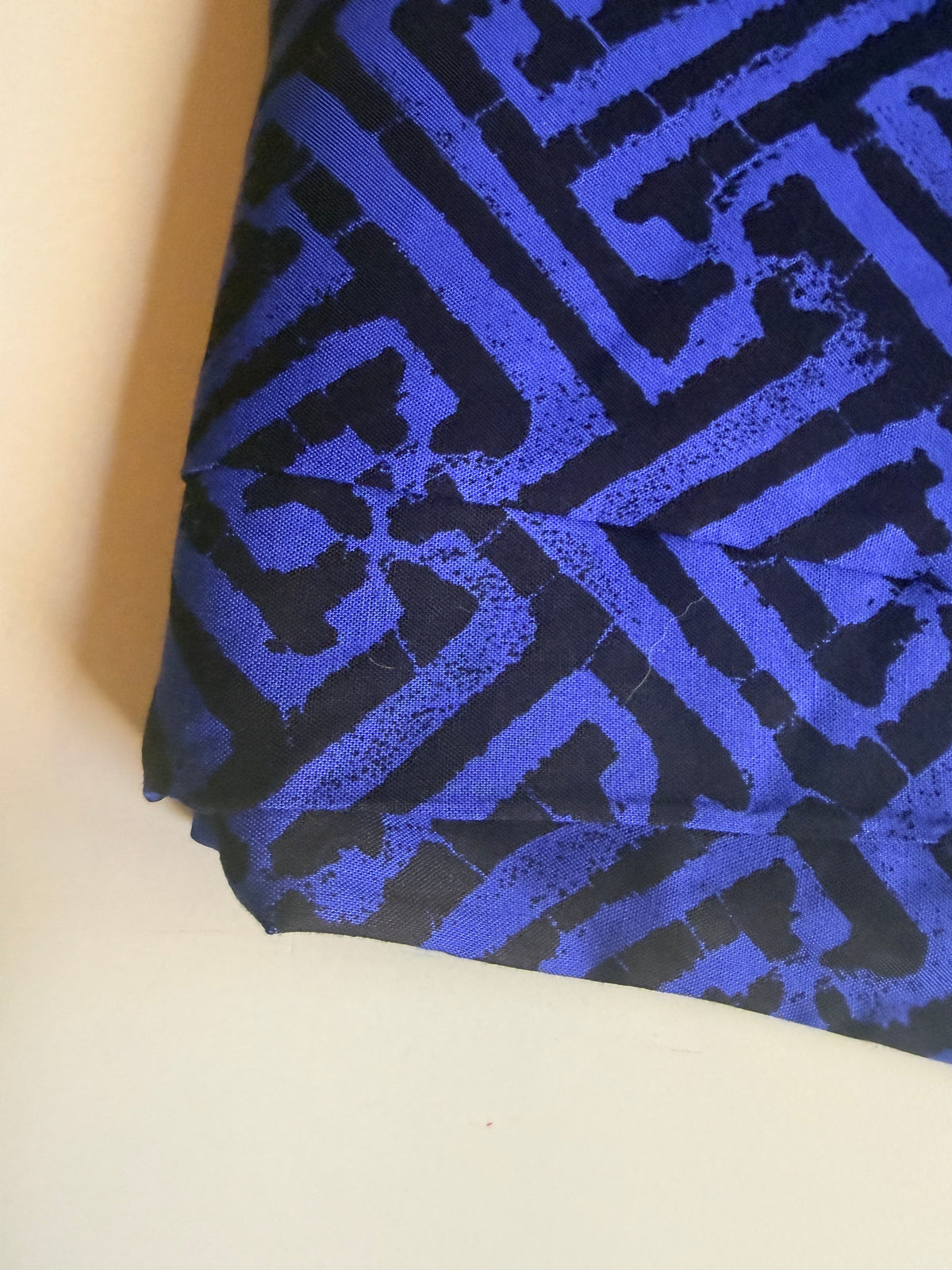 Black and blue geometric intricate maze-like motif