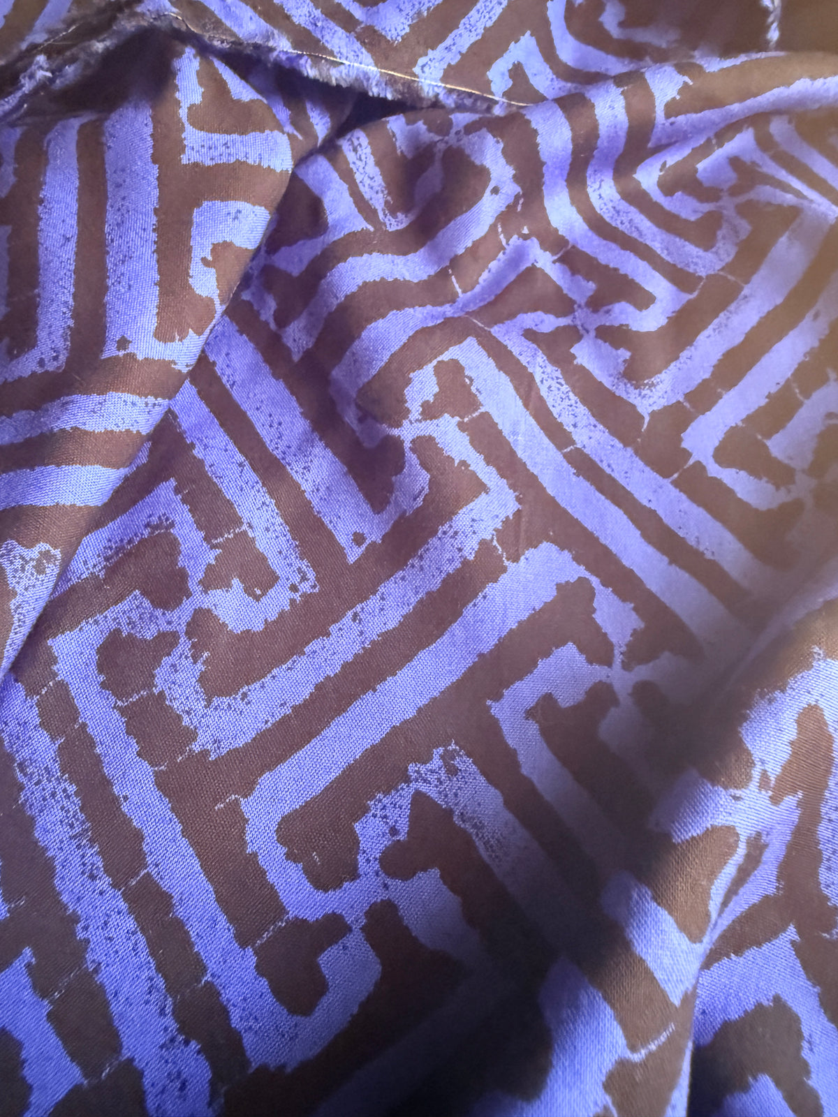 Black and blue geometric intricate maze-like motif