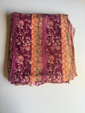 Intricate floral motifs with horizontal stripes in warm tones