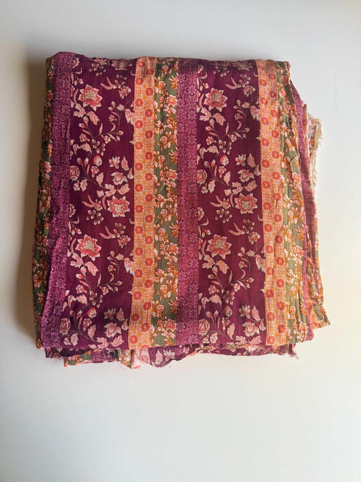 Intricate floral motifs with horizontal stripes in warm tones