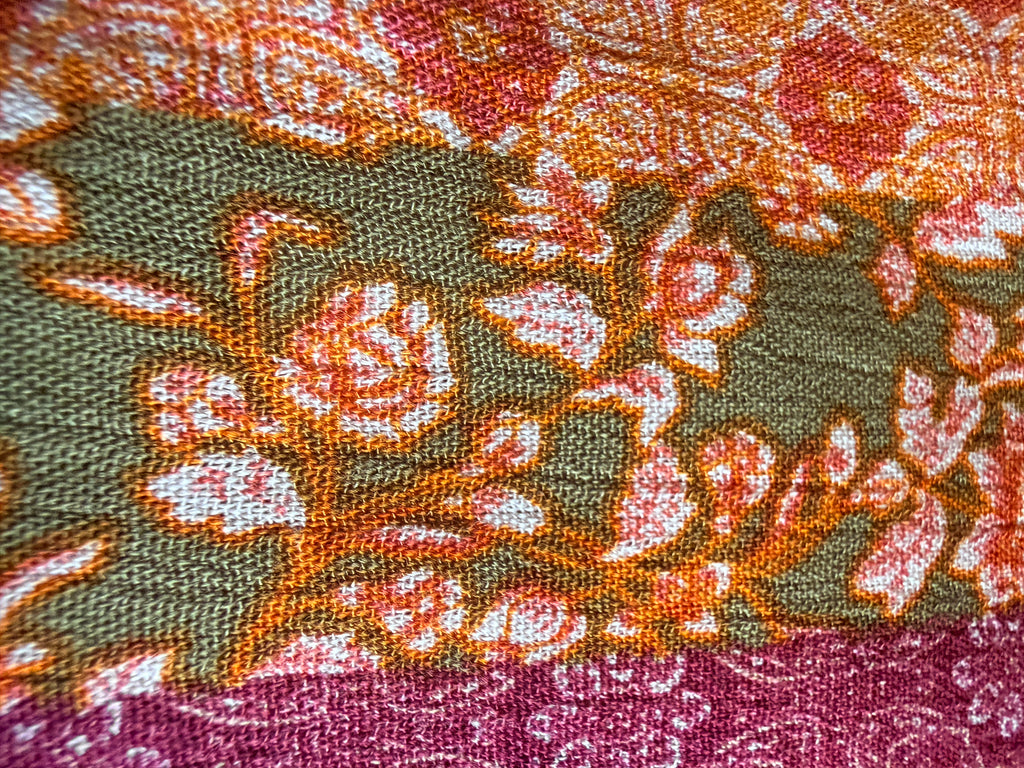 Intricate floral motifs with horizontal stripes in warm tones