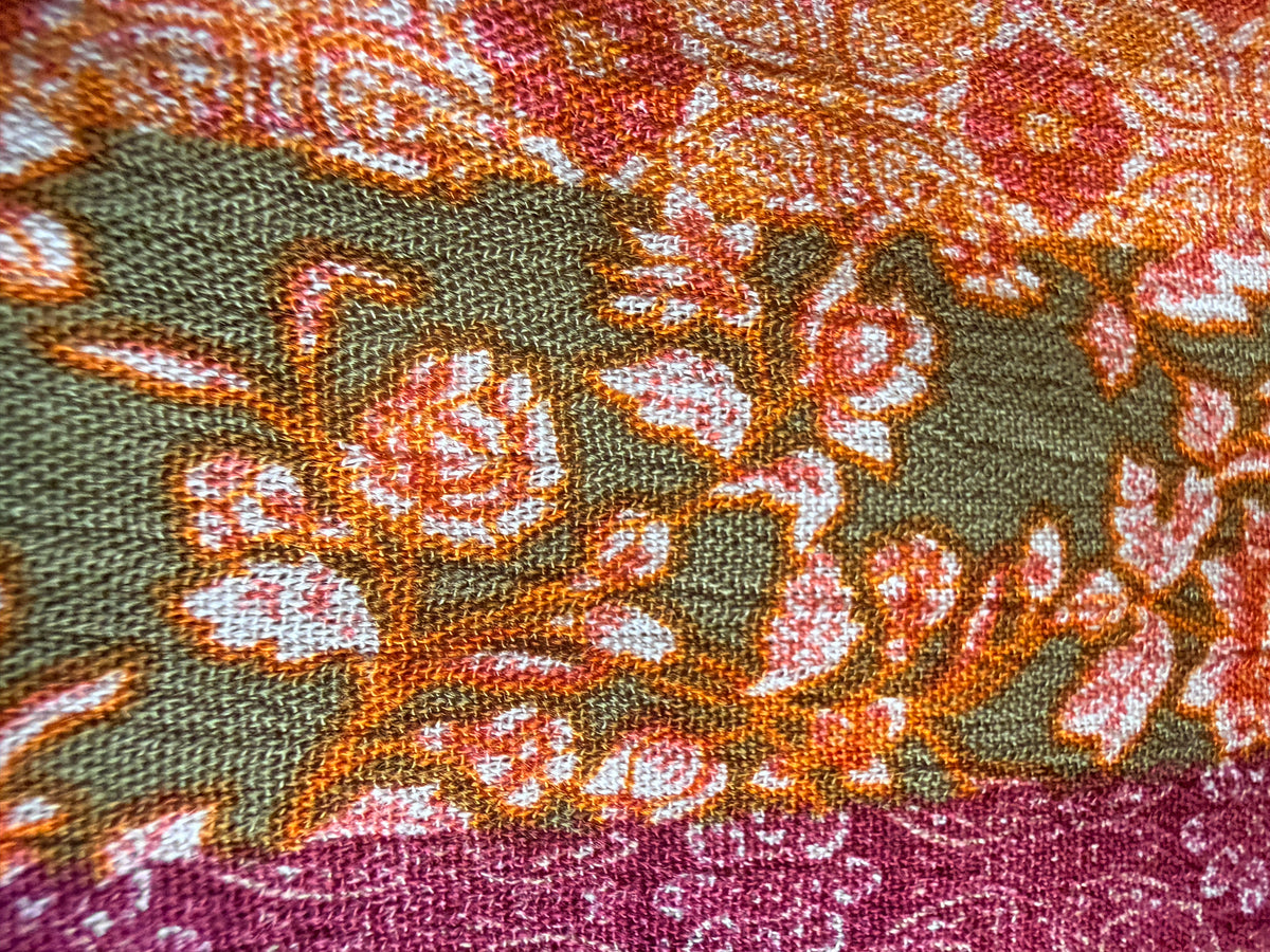 Intricate floral motifs with horizontal stripes in warm tones