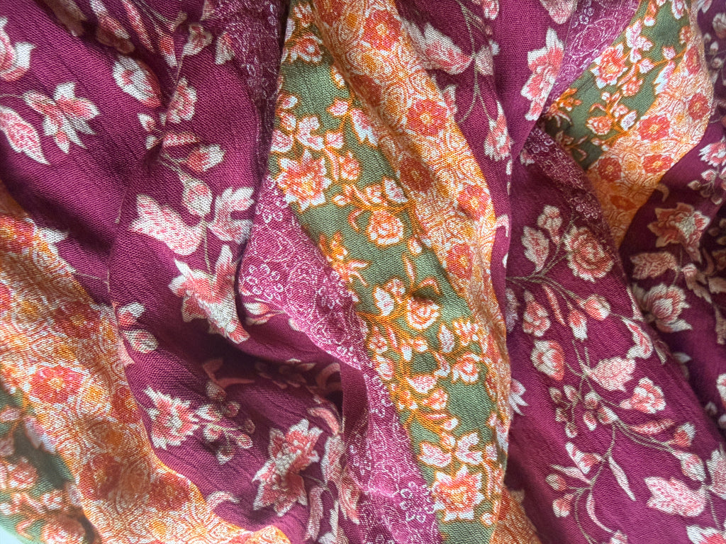 Intricate floral motifs with horizontal stripes in warm tones
