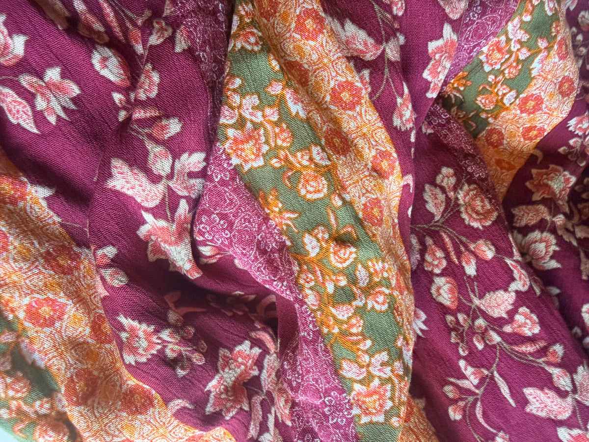Intricate floral motifs with horizontal stripes in warm tones