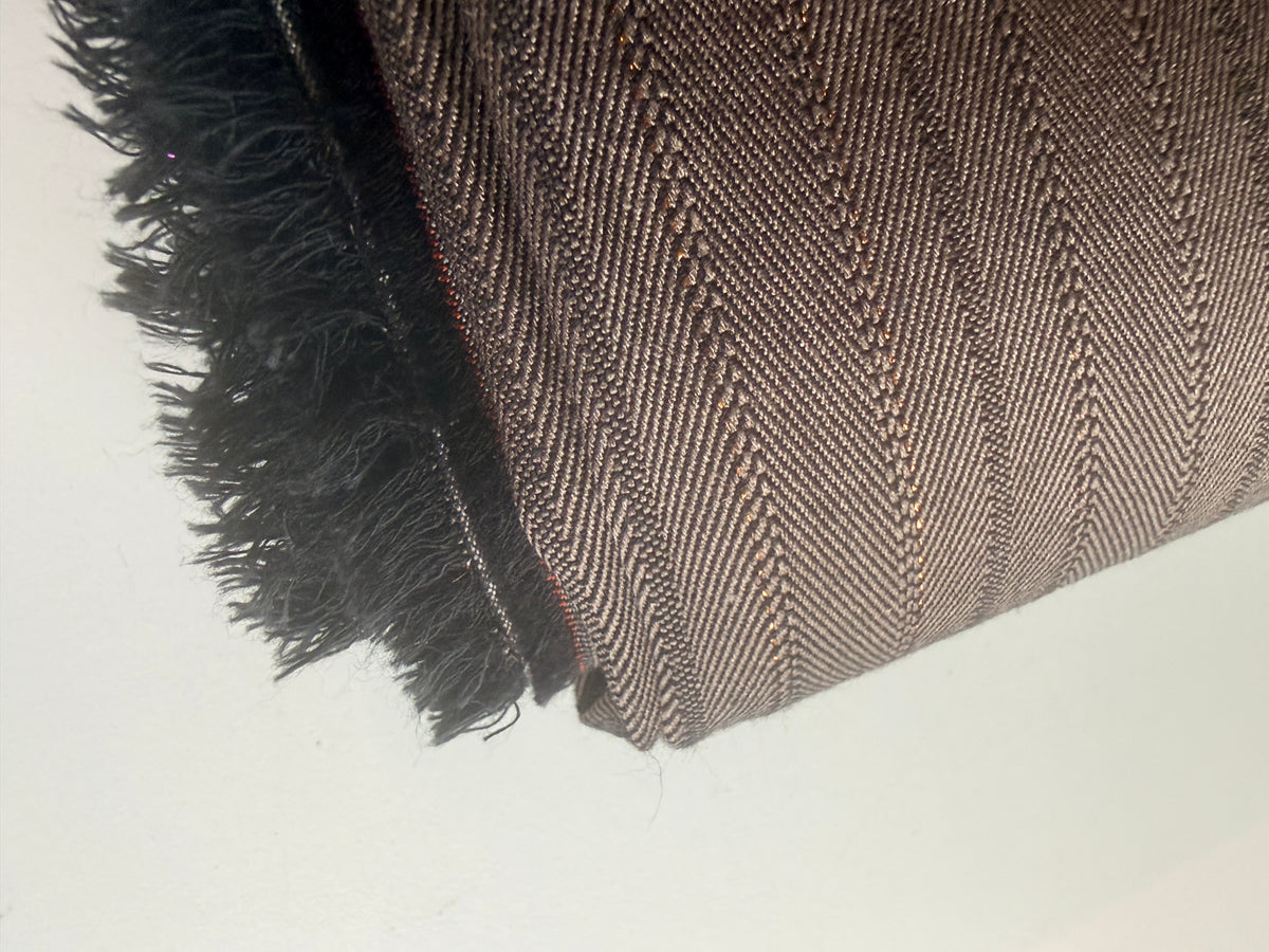 Subtle Herringbone print with gold accents Wool