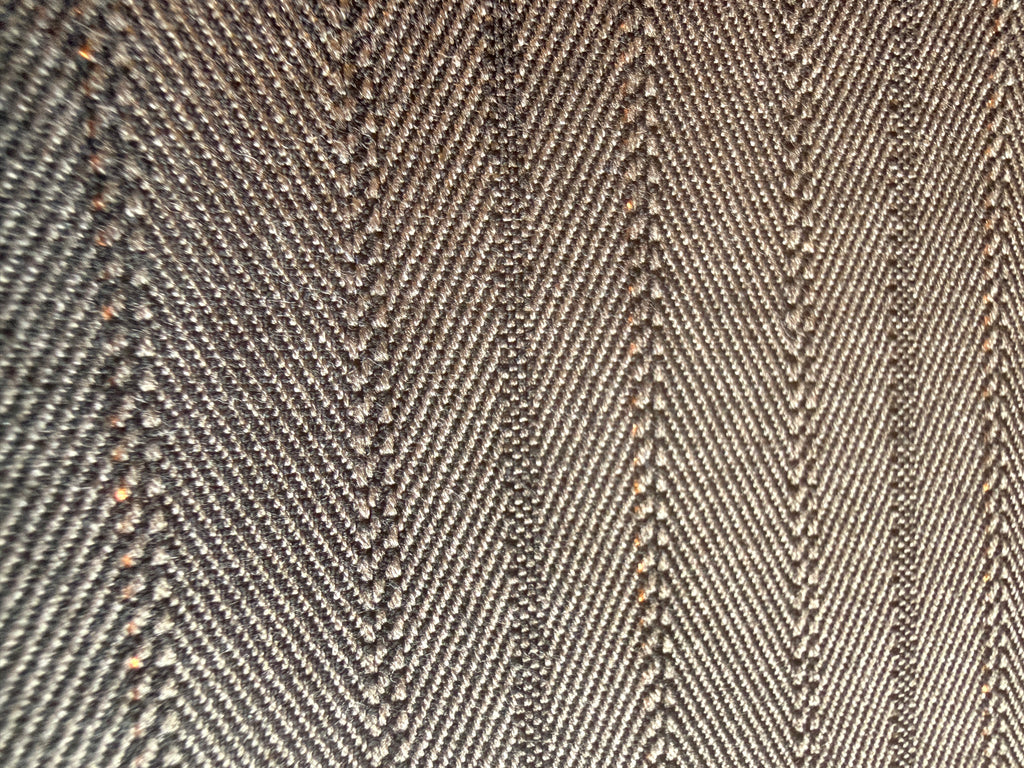 Subtle Herringbone print with gold accents Wool