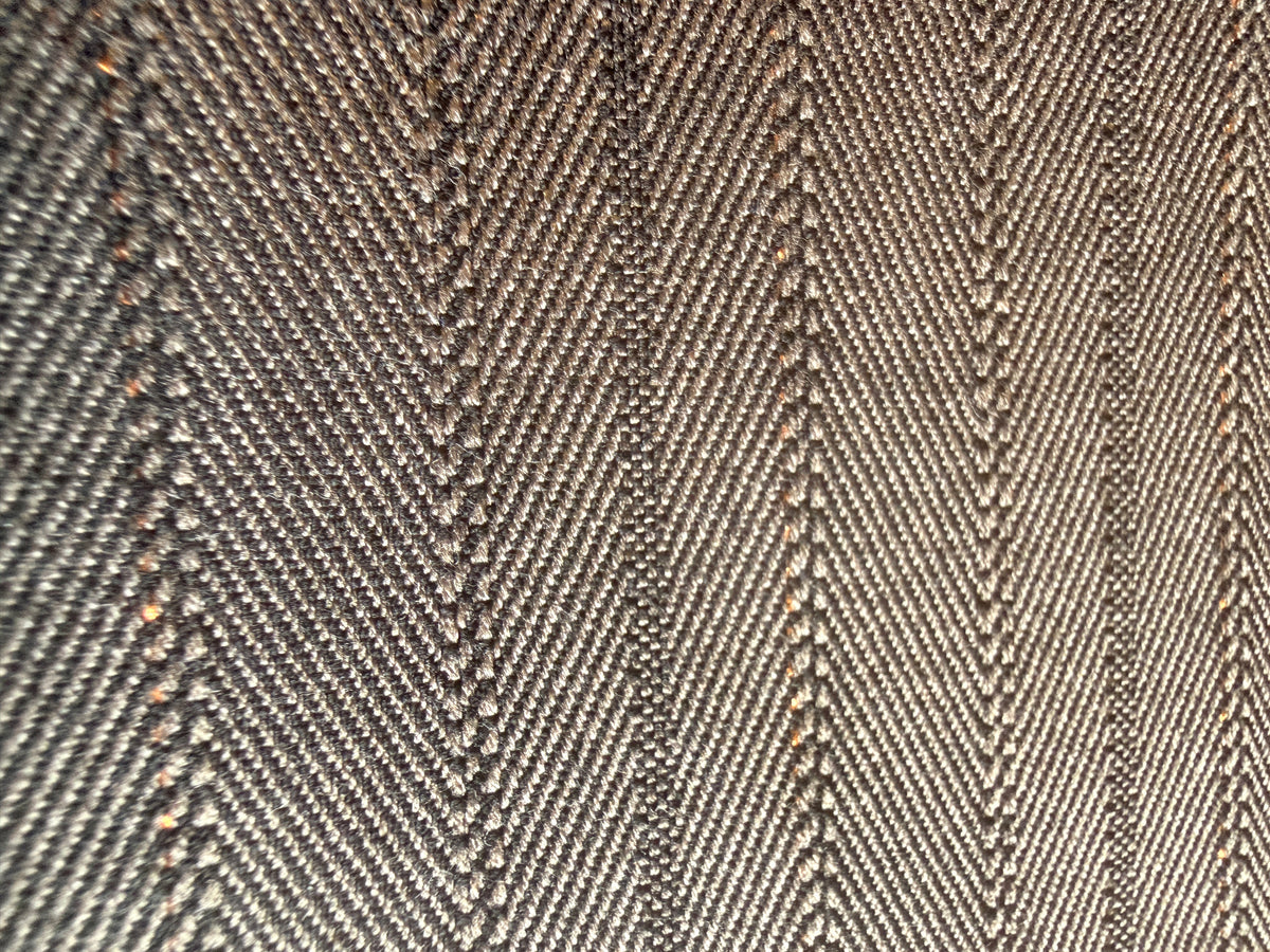 Subtle Herringbone print with gold accents Wool