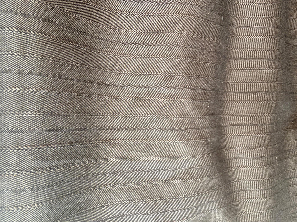 Subtle Herringbone print with gold accents Wool
