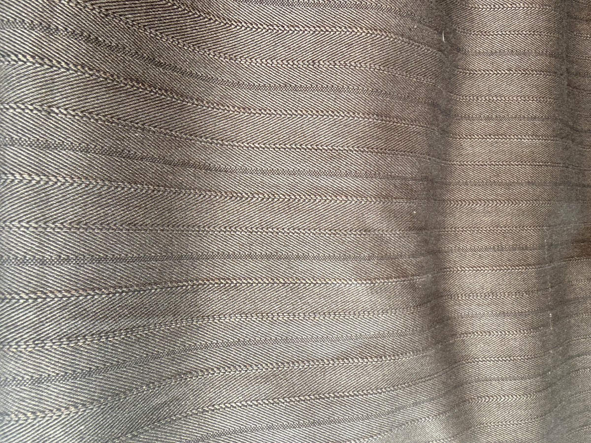 Subtle Herringbone print with gold accents Wool